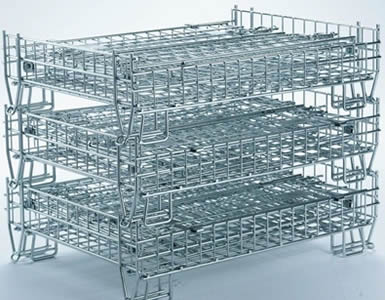 Three folded American style wire containers with galvanized surface are stacking together on the floor.